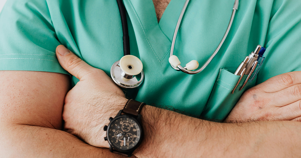 Consultant cardiologist reviewing medical records