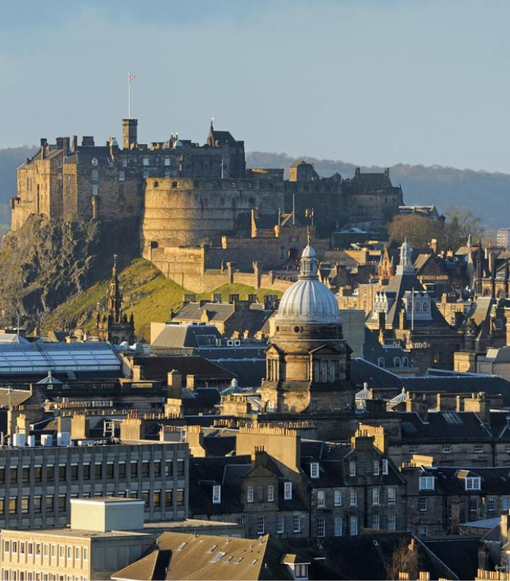Consultant cardiologist in a UK office reviewing ECG records and cardiology documents for a medico-legal report in Edinburgh.