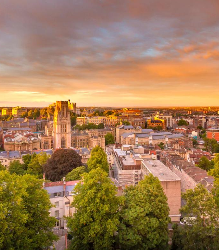 A consultant cardiologist in a UK office carefully reviews medical records and diagnostic reports as part of a CPR Part 35-compliant expert witness assessment for Bristol and South West claims.