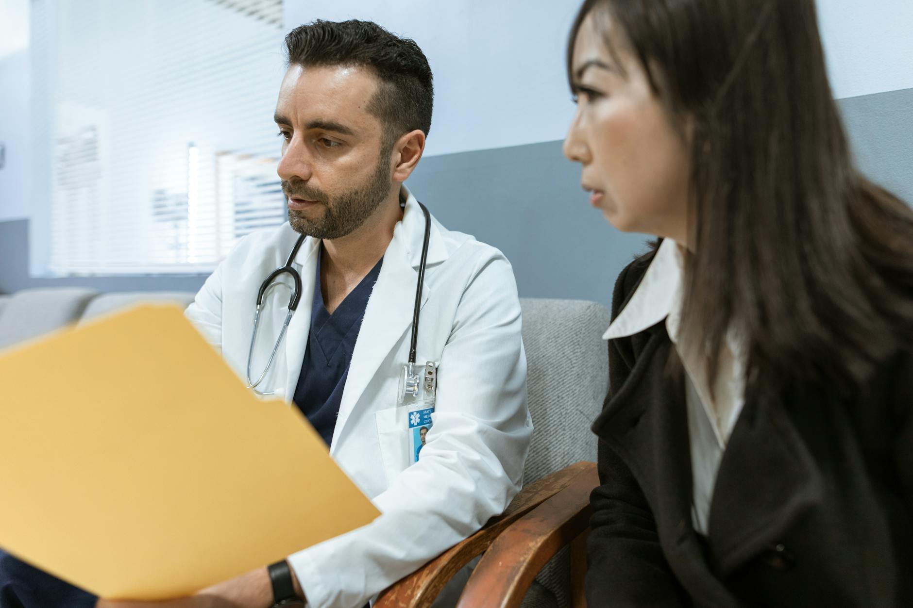 Consultant cardiologist reviewing a condition and prognosis report