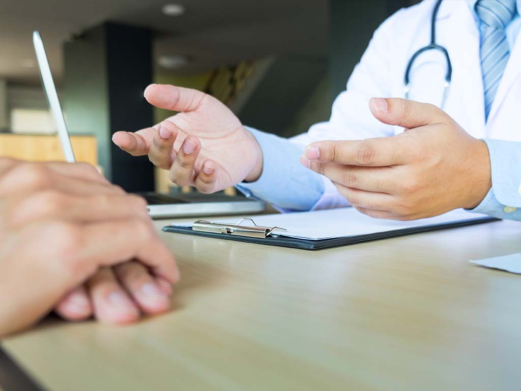 Consultant cardiologist reviewing claimant records