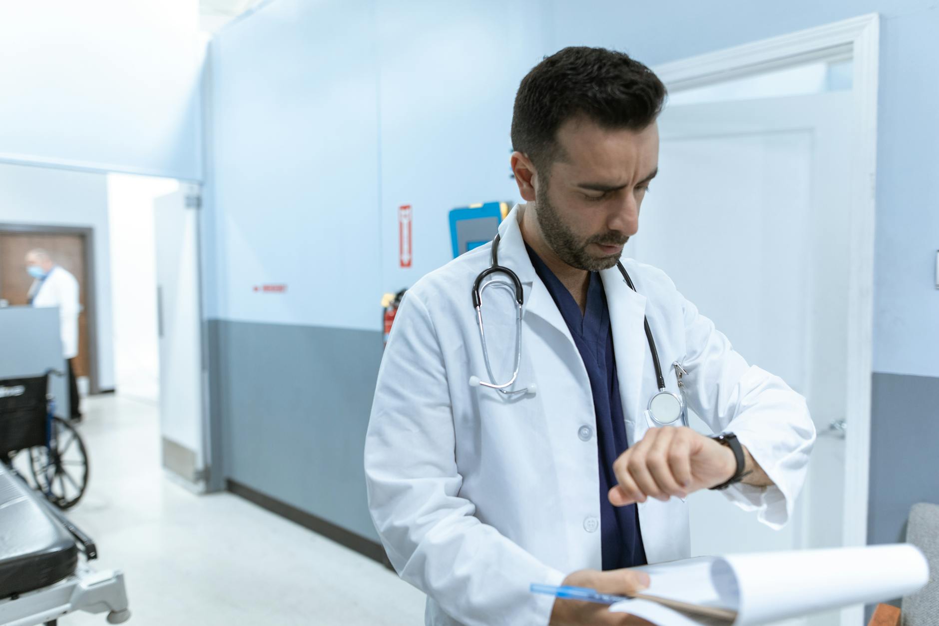 Consultant cardiologist assessing cardiac fitness for trial